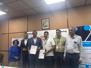 leaders from both organizations formalising a strategic partnership, marking a new ch