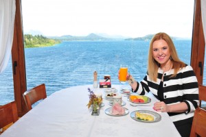 Silvina Luna enjoying a serene morning by Lake Nahuel Huapi, Patagonia.