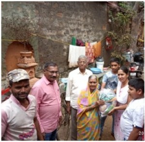 Dr. Sanjay Koli and family members while Distribution of goods.