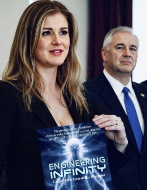 Natalja Sticco holds the book central to a new report to Congress on UAP and classified technology