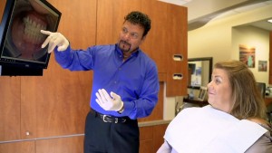 Milwaukee dentist Dr Cigno explaining the advantages of Fastbraces to orthodontic patient at Cigno F