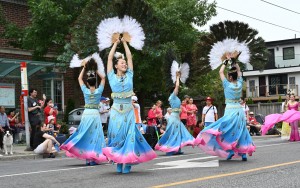 The elegant peacock spreads positive energy and messages of love and peace at Canada Day Parade.