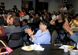 Crowd claps for keynote speaker, Erika Alexander 