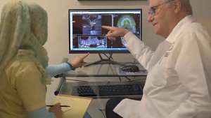 Sterling dentist Dr E Richard Hughes DDS discussing dental implants procedure and treatment plan