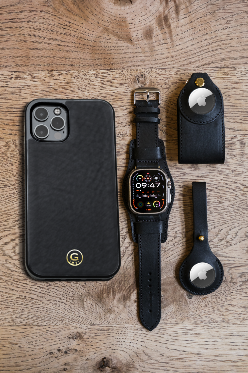 Iphone watch key holder luggage tag on wooden table Iphone watch key holder luggage tag on wooden table