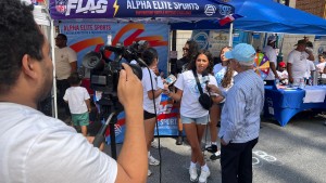 Sophia Ramos being interviewed at the Dominican Festival in Yonkers, August 2025