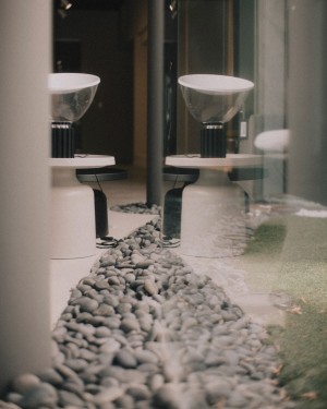 pebble-lined courtyard pulls landscape indoors in a nod to West Coast modernists