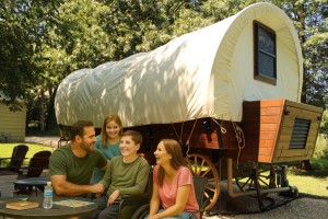 Family camping with wheelchair-accessible PlainsCraft Covered Wagon
