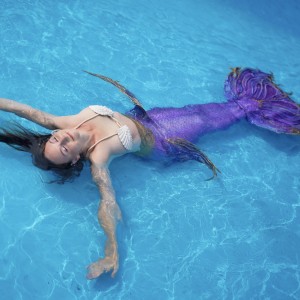 Mermaid Marielle floating in pool  Aquamermaid