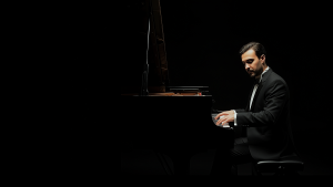 Dlzar Abedi performing during a symphonic recording session