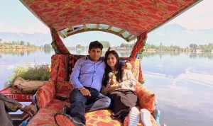 couple in shikara travelling with Falcon Trails