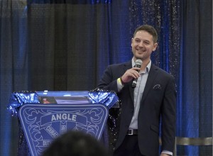 Andrew Lee Jenkins professional speaker at event with microphone and podium