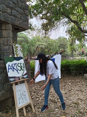 Leena Joshi delivering a speech about how art can be used as a tool for climate advocacy