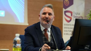 Gabriele Gobbo speaking about digital literacy and tech history at a major industry event.