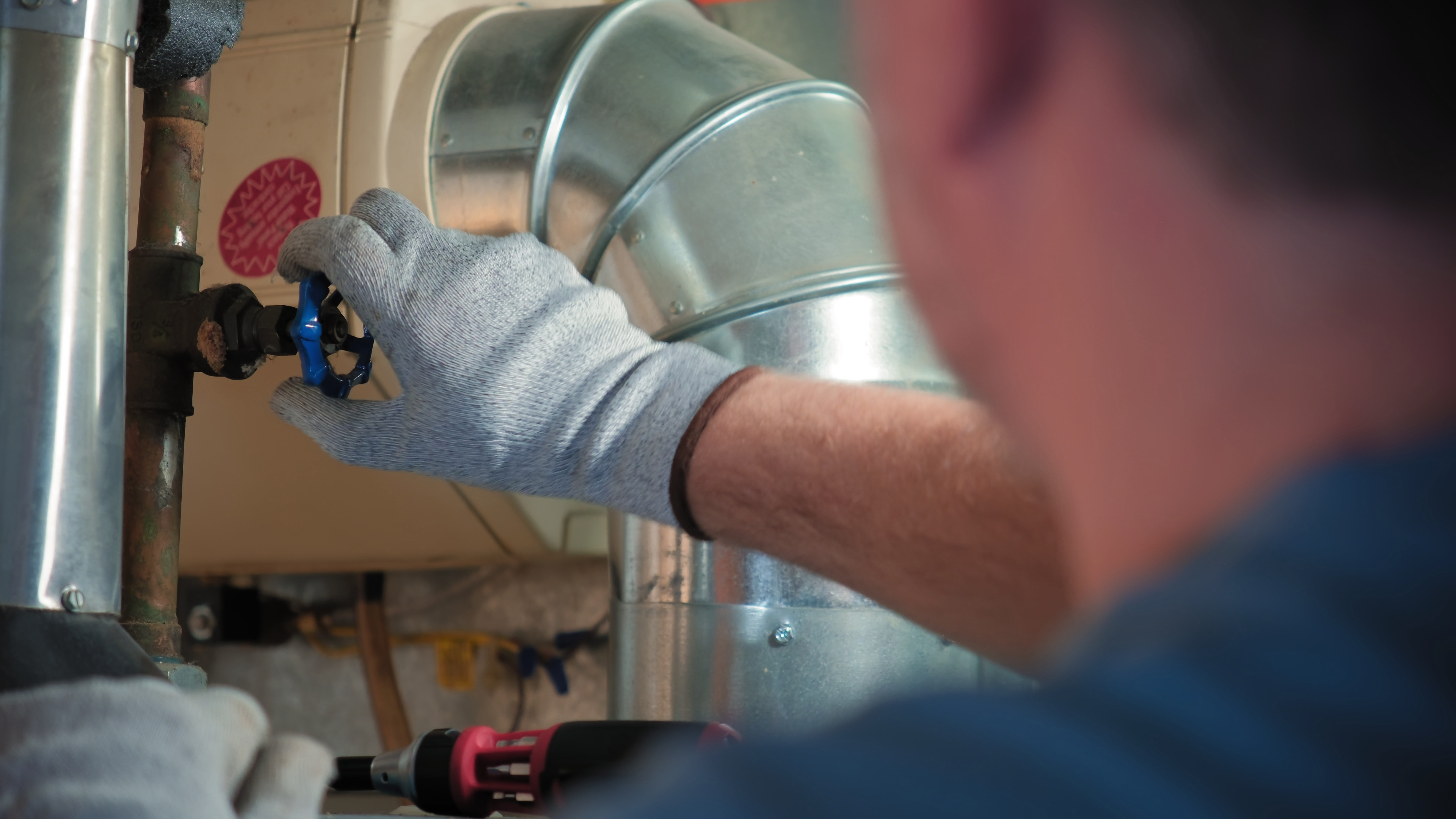 the serviceman diagnose the hvac system in the house on mechanical room SBI 349504667 the serviceman diagnose the hvac system in the house on mechanical room SBI 349504667