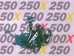 The VOLT e-bike transformed with models in background