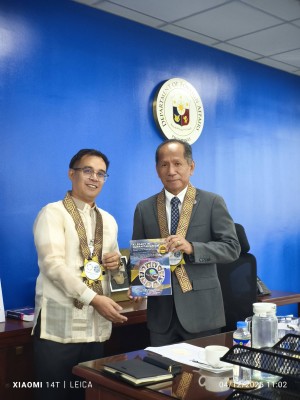 Hon. Badajos and GM Banzuela with the Book, honoring humanitarian excellence.