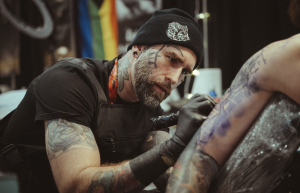 Jordi Pla tattooing at the Flower City Tattoo Convention