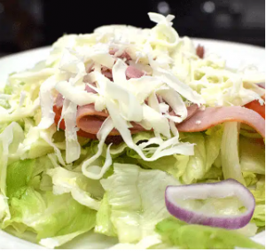 Fresh Italian salad with house dressing at Joe’s Pizza Mesquite TX