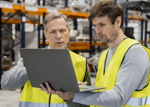 men warehouse working laptop