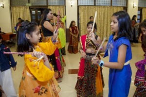 Students playing Dandiya 