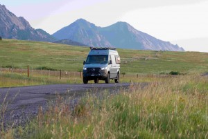 sleek camper van parked on a serene country road