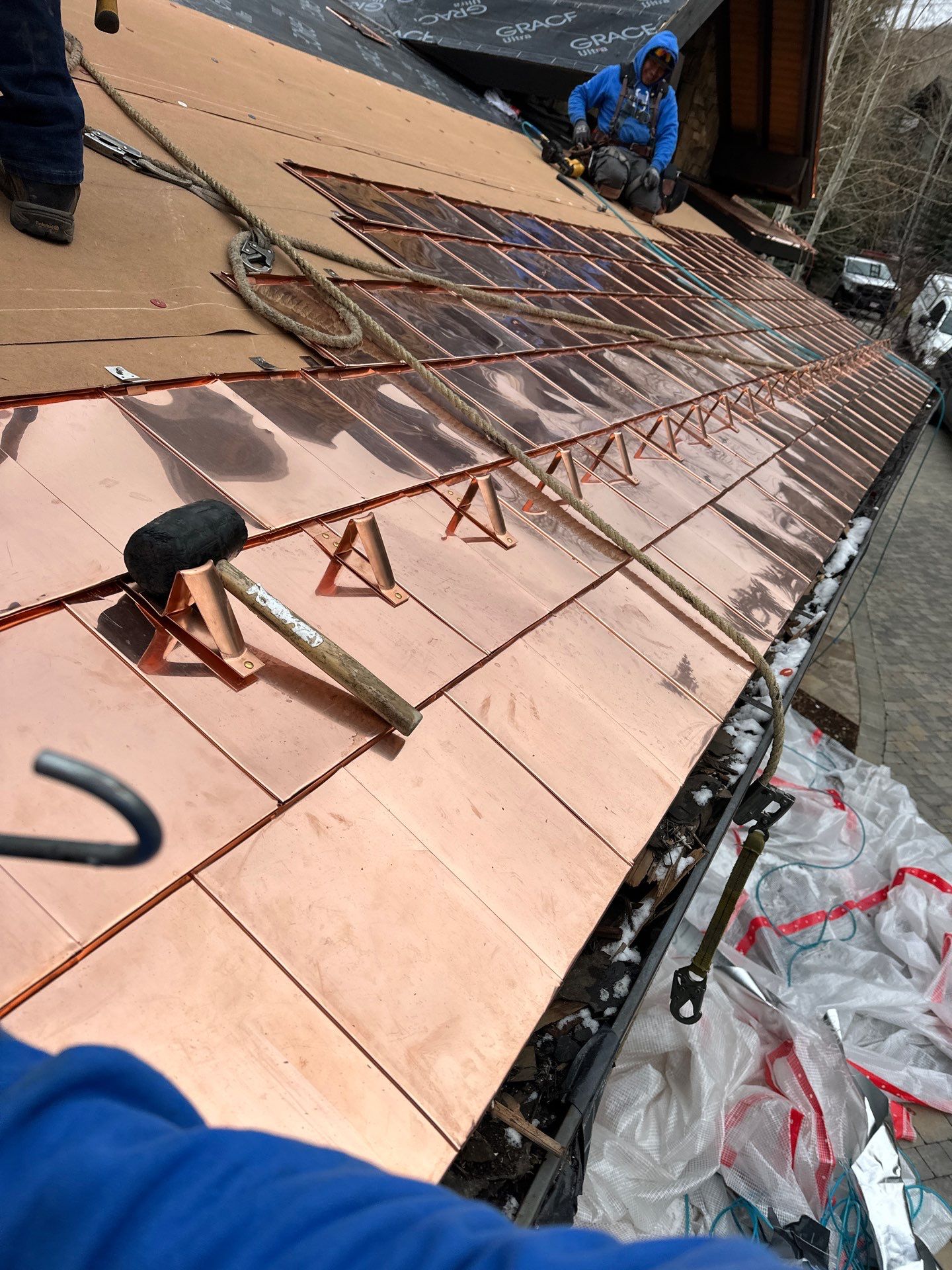 Copper roof getting RG10 copper snow guards installed by Umbrella Roofing team member Copper roof getting RG10 copper snow guards installed by Umbrella Roofing team member