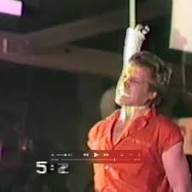 Escape Artist Michael Griffin with hands tied behind back hanging Escape Artist Michael Griffin with hands tied behind back hanging