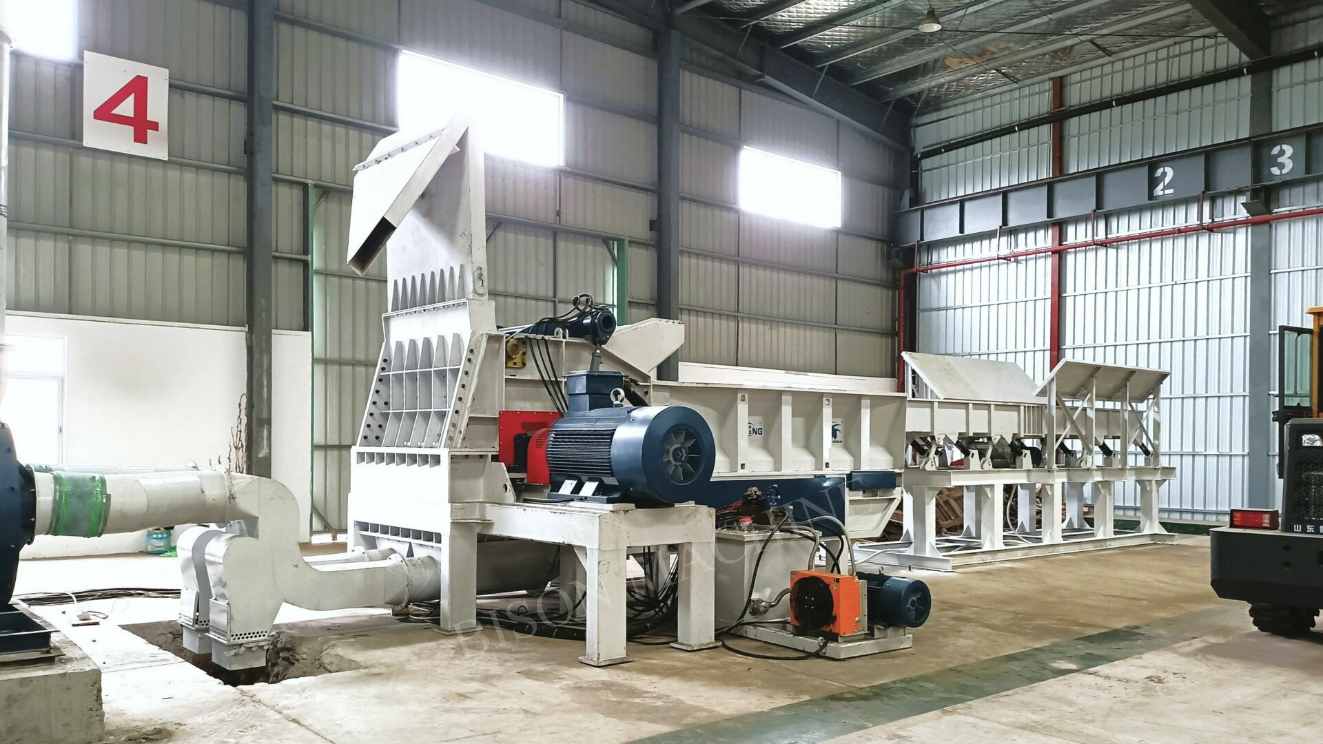 Processing recycled wood waste such as shipping pallets presents unique challenges