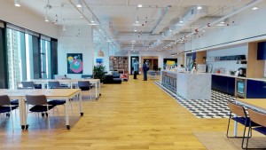 Floor-to-ceiling windows, a light-filled airy environment pulsing with energy.