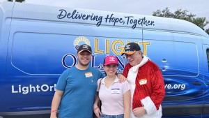 Directors Alex and Angie Tolan with Coach M J