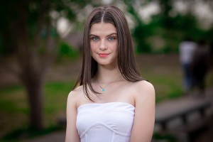 Natural light outdoor senior portrait with clean modern look and soft background
