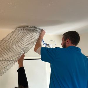 Professional air duct cleaning in progress by Teasdale Fenton