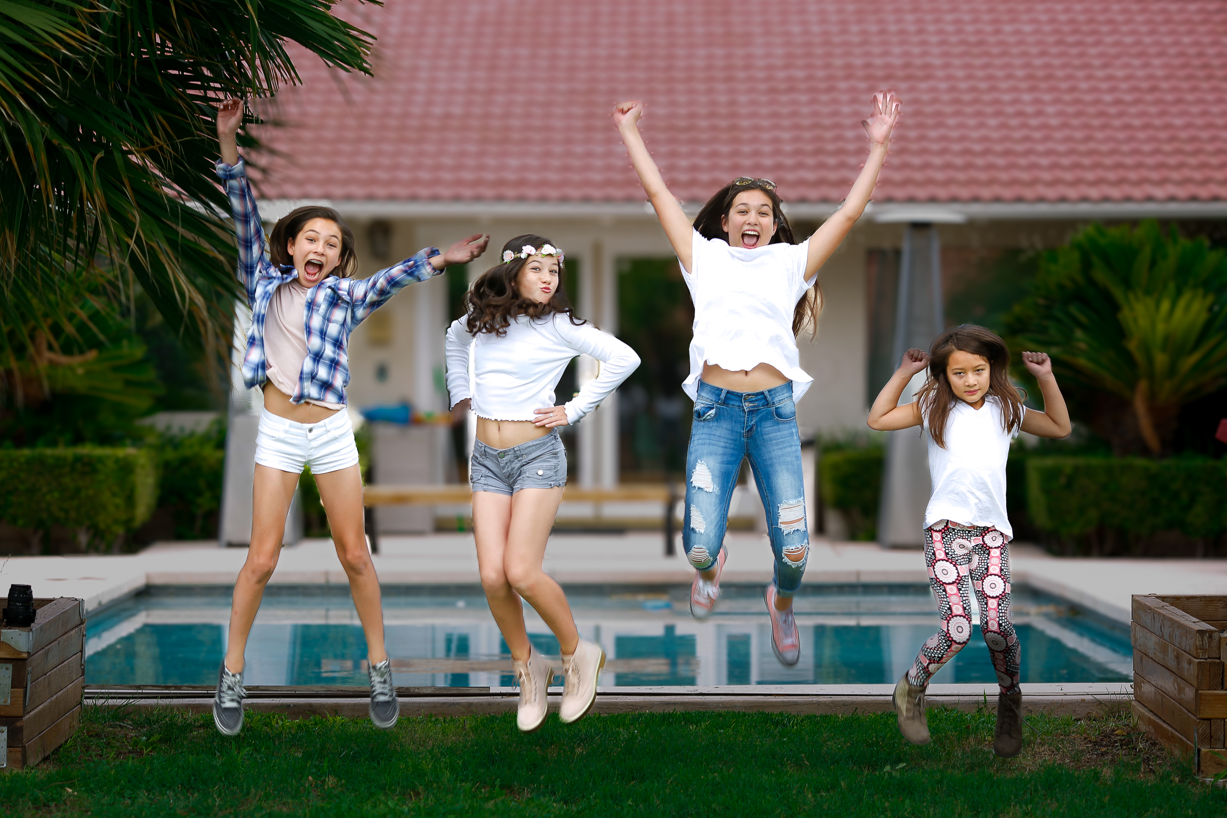 Family jumping together during a fun outdoor portrait session in Las Vegas