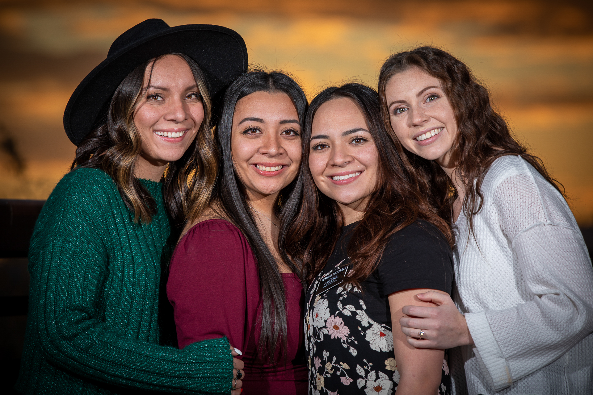 Studiostyle portrait of friends with clean lighting and warm tones