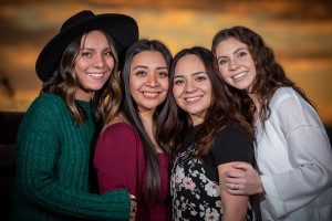 Studio-style portrait of friends with clean lighting and warm tones