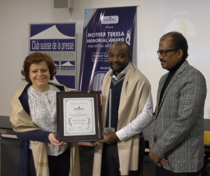Junior Nzita Nsuami accepting the Mother Teresa Memorial Award