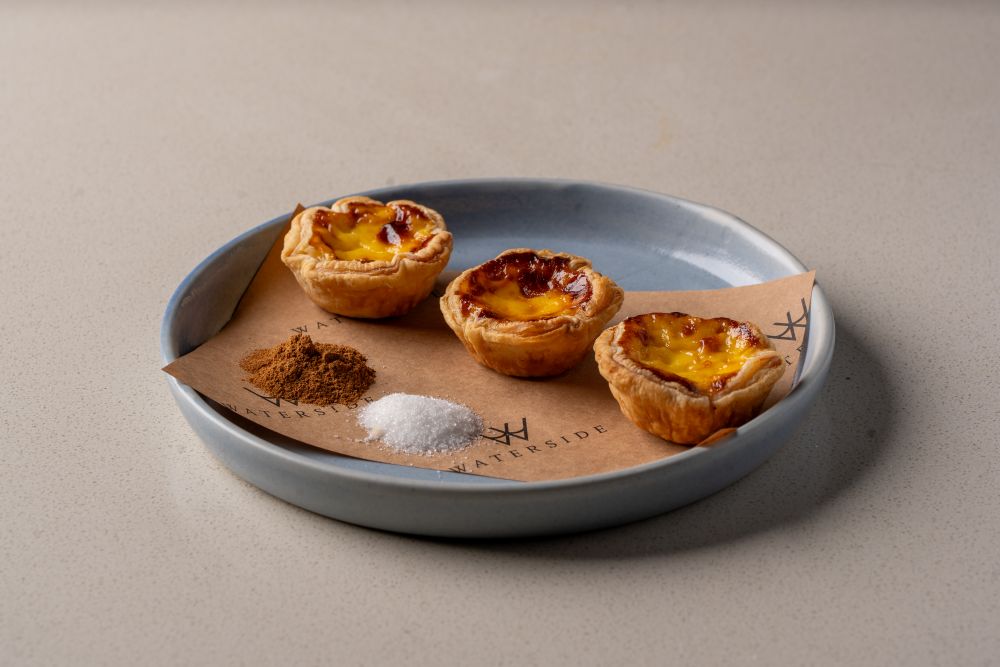 Portugals Pastel de Nata with Flaky Buttery Pastry and Creamy Custard Portugals Pastel de Nata with Flaky Buttery Pastry and Creamy Custard