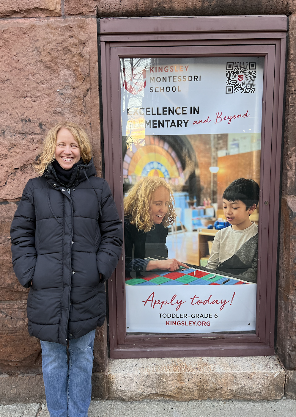 Anne MacMillan stands beside a Kingsley advertisement featuring her teaching Anne MacMillan stands beside a Kingsley advertisement featuring her teaching