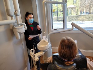 Dental hygienist preparing patient for the best porcelain veneers treatment in Salem MA