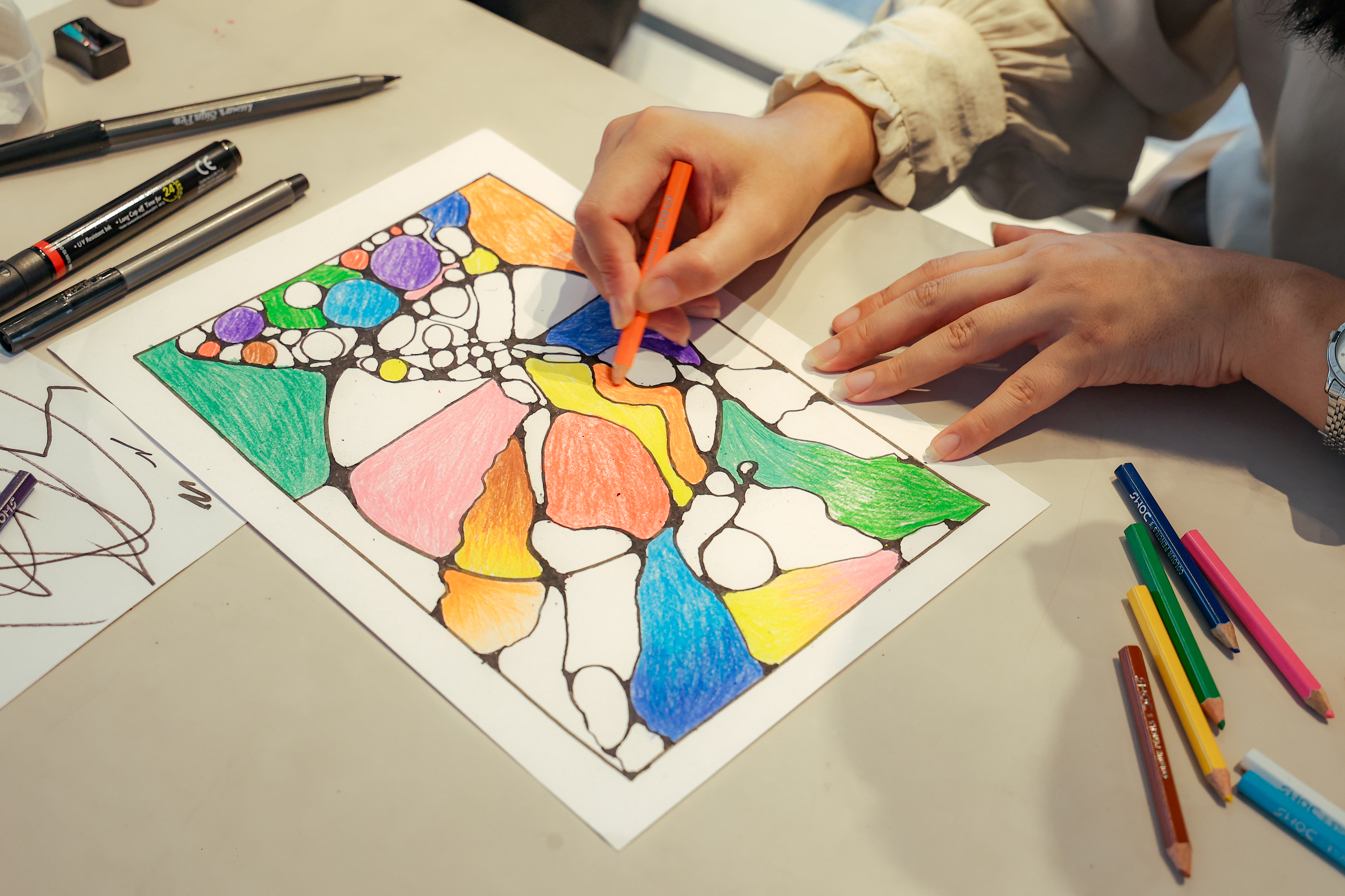 client making art during an art class at veda sikkim
