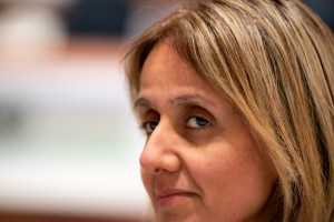 A delegate listens during an AIFOD summit working session