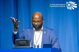 A keynote speaker on stage at the AIFOD Vienna Summit 2025