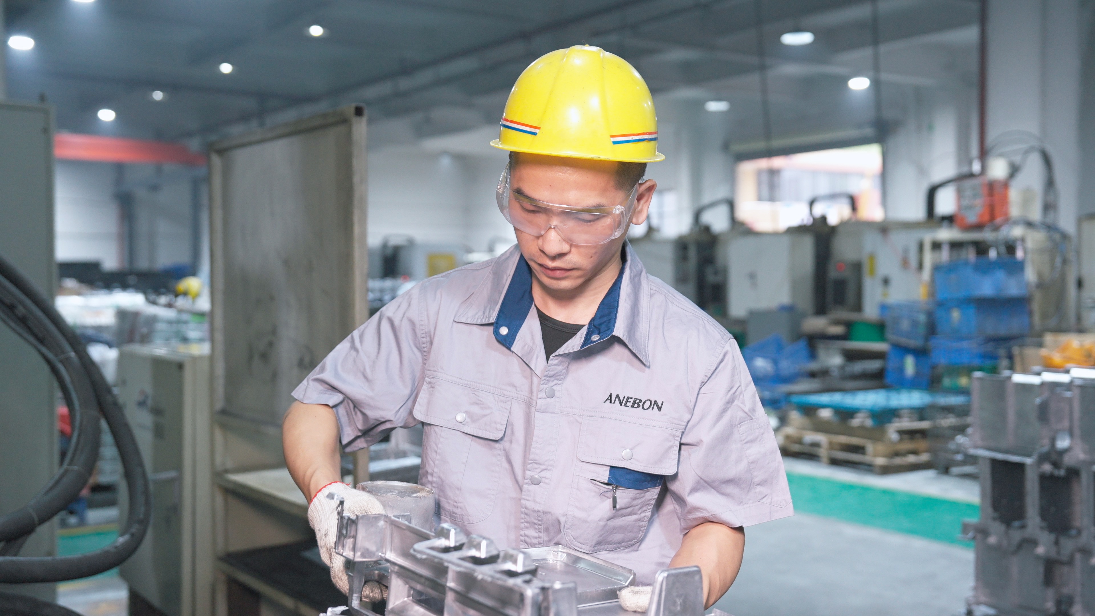 Anebon Technician Inspecting a Precision Metal Component on the Manufacturing Floor