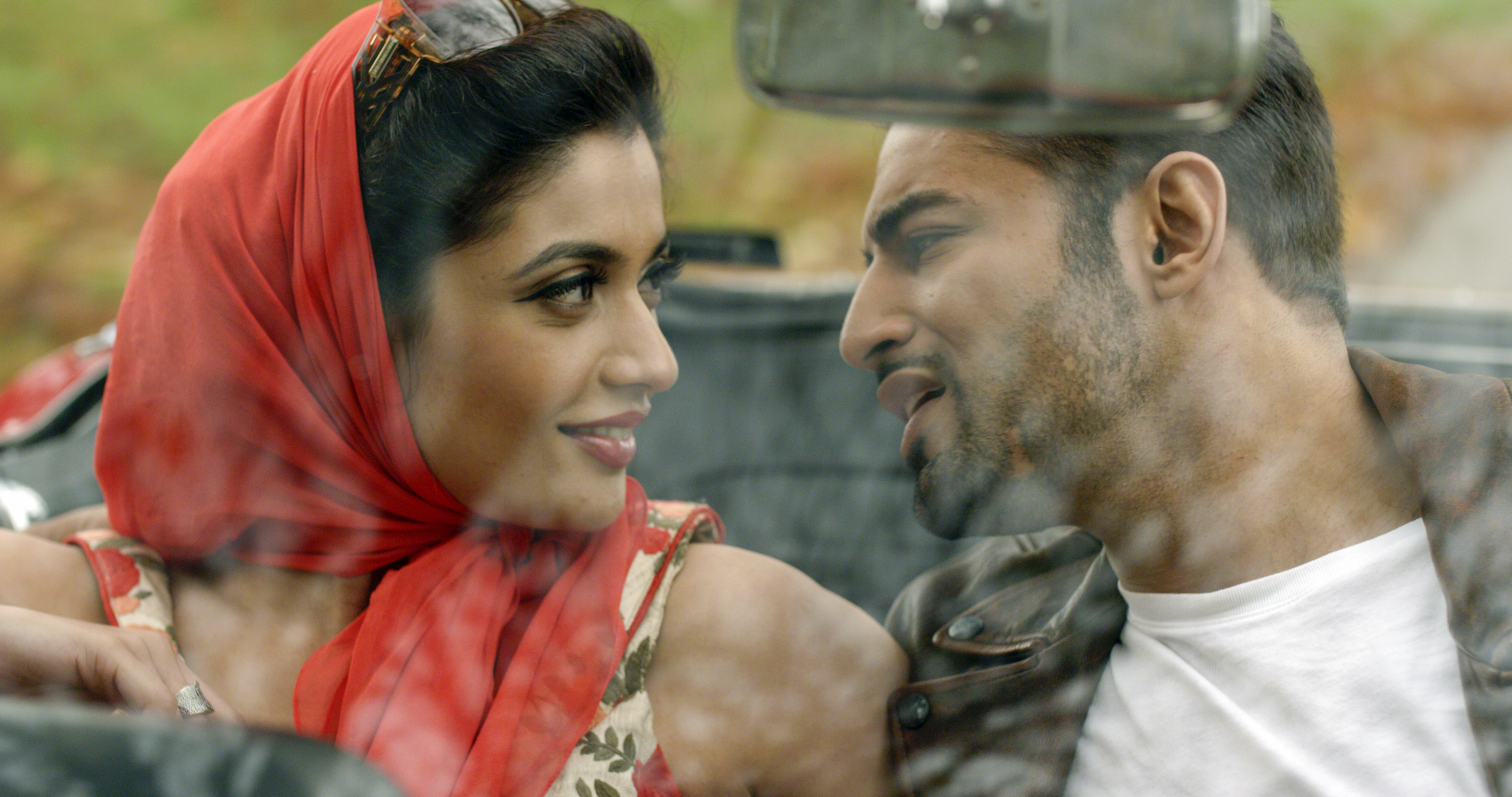 Natasha Fernandez  Upen Patel closing up in the song 