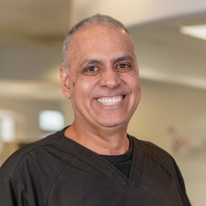 Dr Navdeep Virk top rated family dentist at Avenue Dental Care North Spokane offering comprehensive 