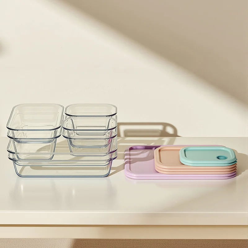 Glass Food Containers And Color Lids Arranged For Compact Storage