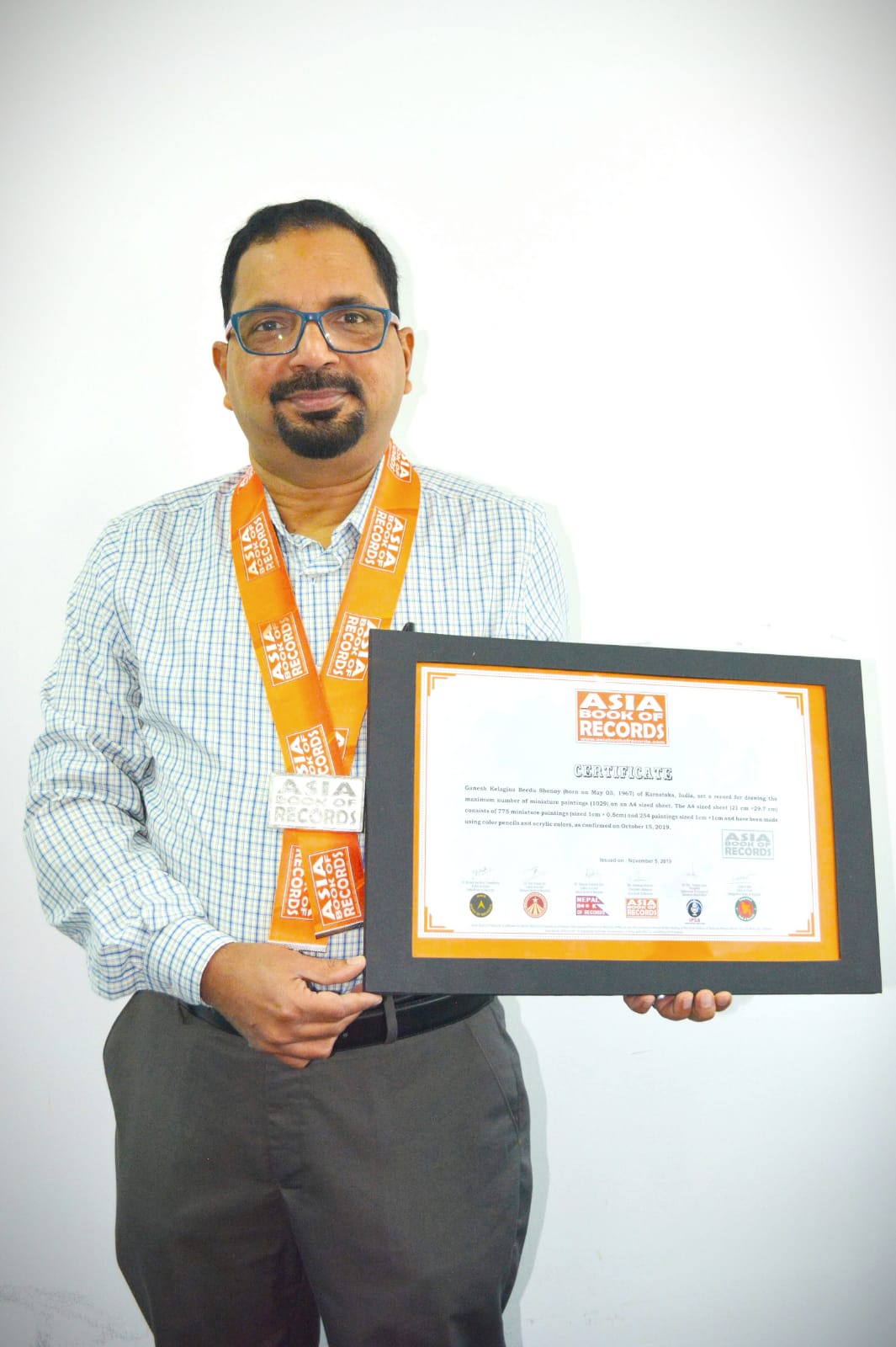 Ganesh Shenoy Wins Asia Record For Maximum Miniature Paintings IssueWire