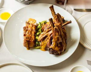 Lamb Rack and Pork Belly Served with Fava Beans and Zucchini Salad