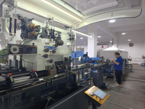 CNC stamping line producing custom metal tins and lids part of JeysTin s in house tea and coffee tin
